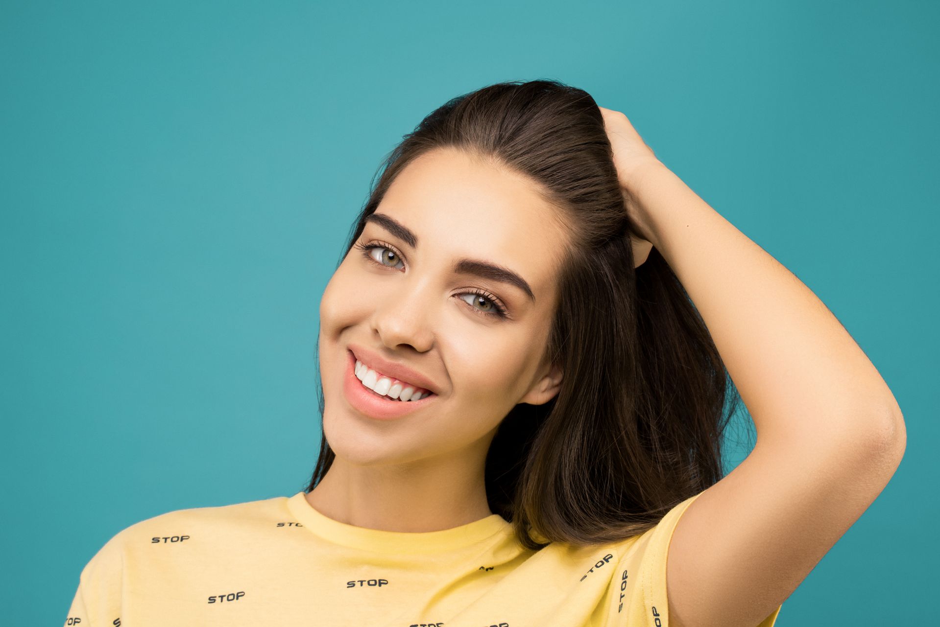 Patient smiling after dental implant treatment